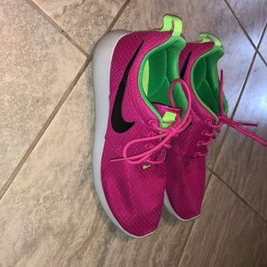 Pink and green Nike Roshe